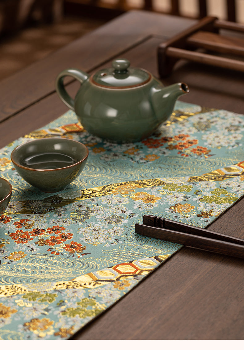 This is a silk brocade tea mat.this is a waterproof table cloth