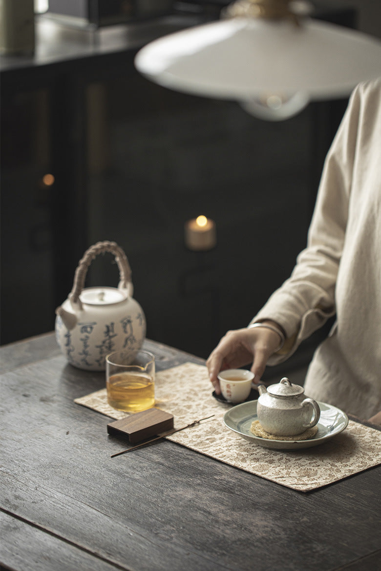 This is a silk brocade tea mat.this is a waterproof table cloth