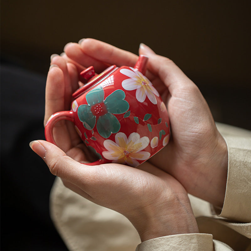 this is a ceramic teapot. this is a red teapot