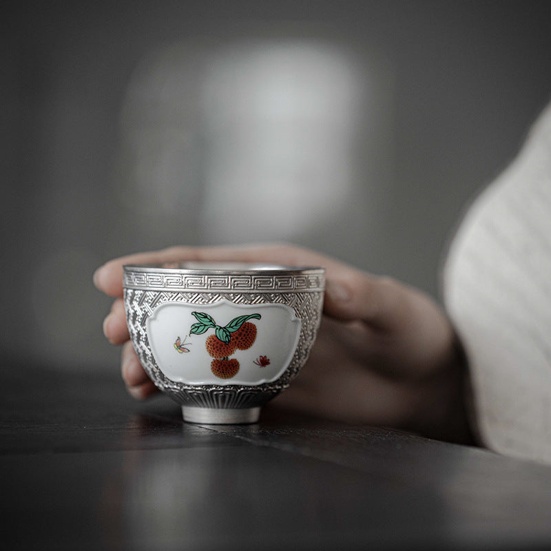 This is a gilted silver ceramic teapot