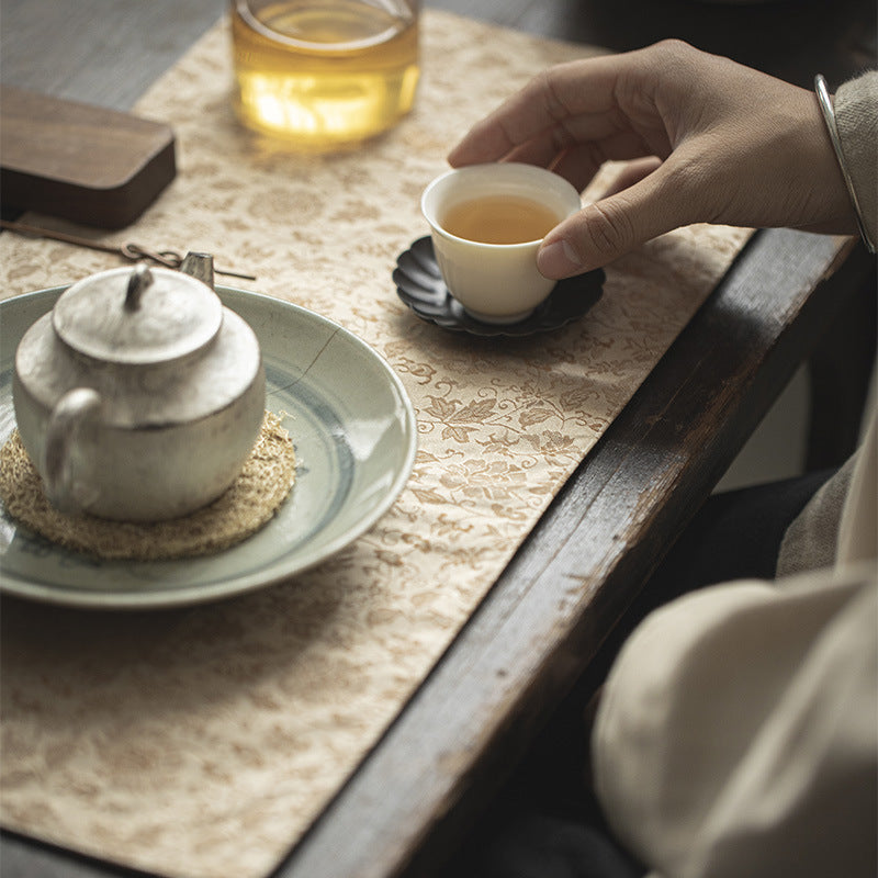 This is a silk brocade tea mat.this is a waterproof table cloth