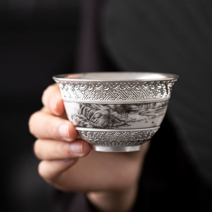 This is a gilted silver ceramic teacup