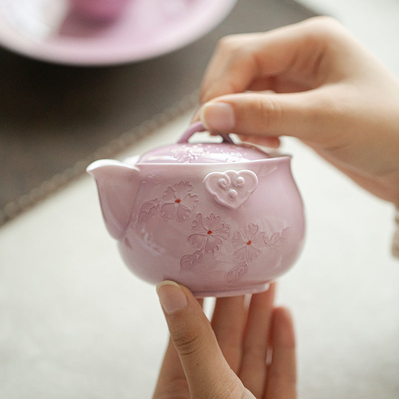 This is a Arita ware teapot. this is a pink ceramic teapot