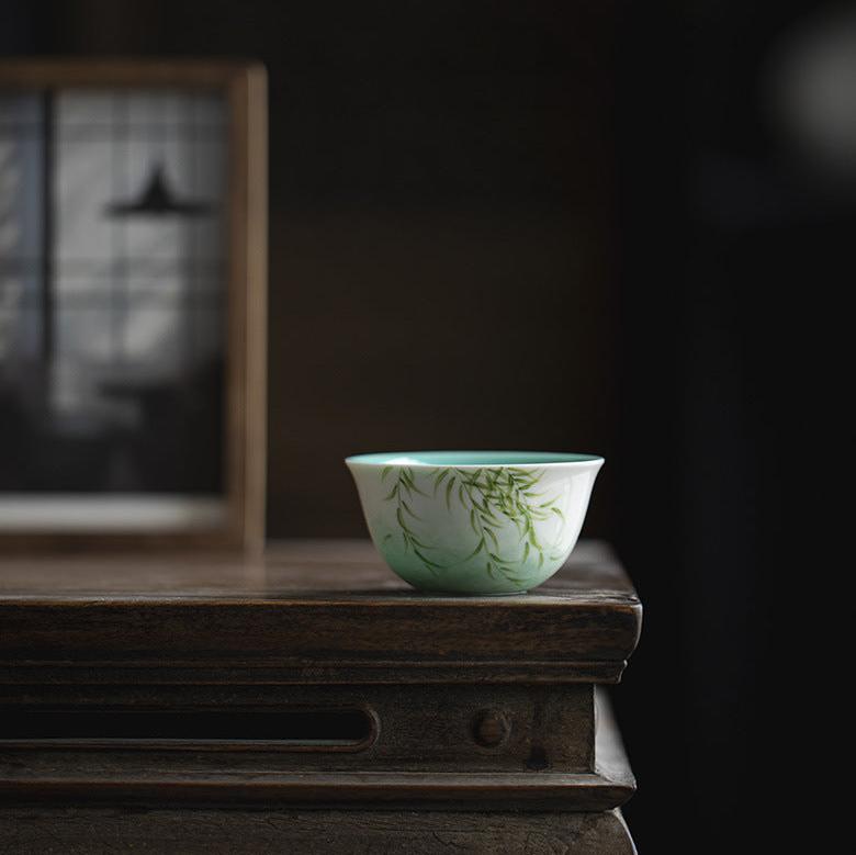 this is a ceramic teapot. this is a green gaiwan