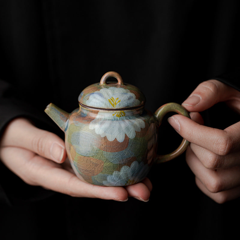 This is a ceramic teapot.this is an iced crackled teapot