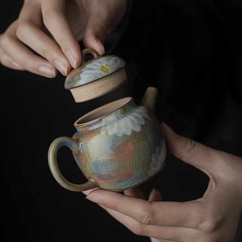 This is a ceramic teapot.this is an iced crackled teapot