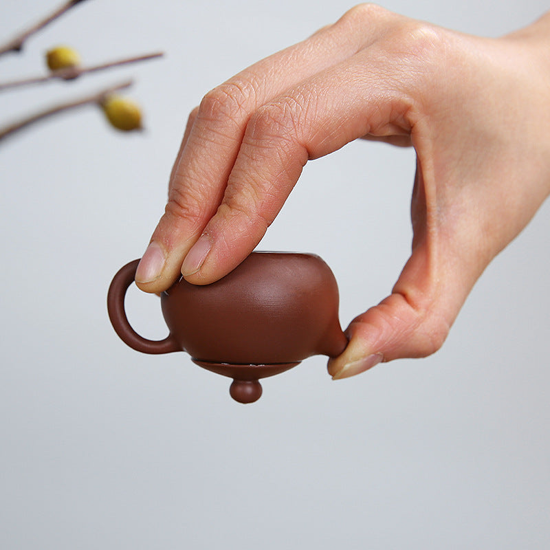 this is a mini zhuni red clay teapot