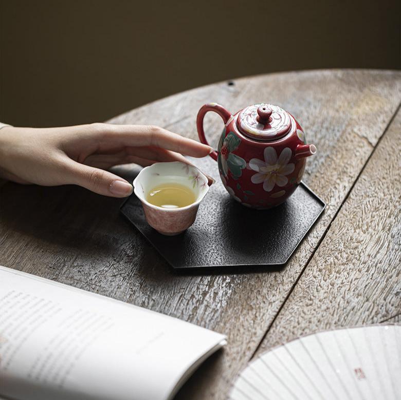 this is a ceramic teapot. this is a red teapot