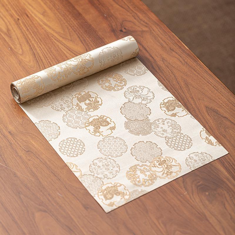 This is a silk brocade tea mat.this is a waterproof table cloth