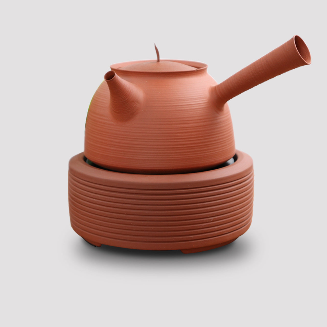 This is a pottery side handle kettle