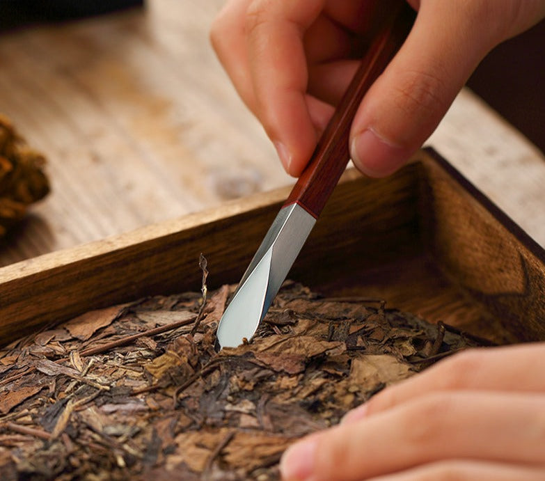 This is a sandalwood puerh cake knife tea knife tea needles