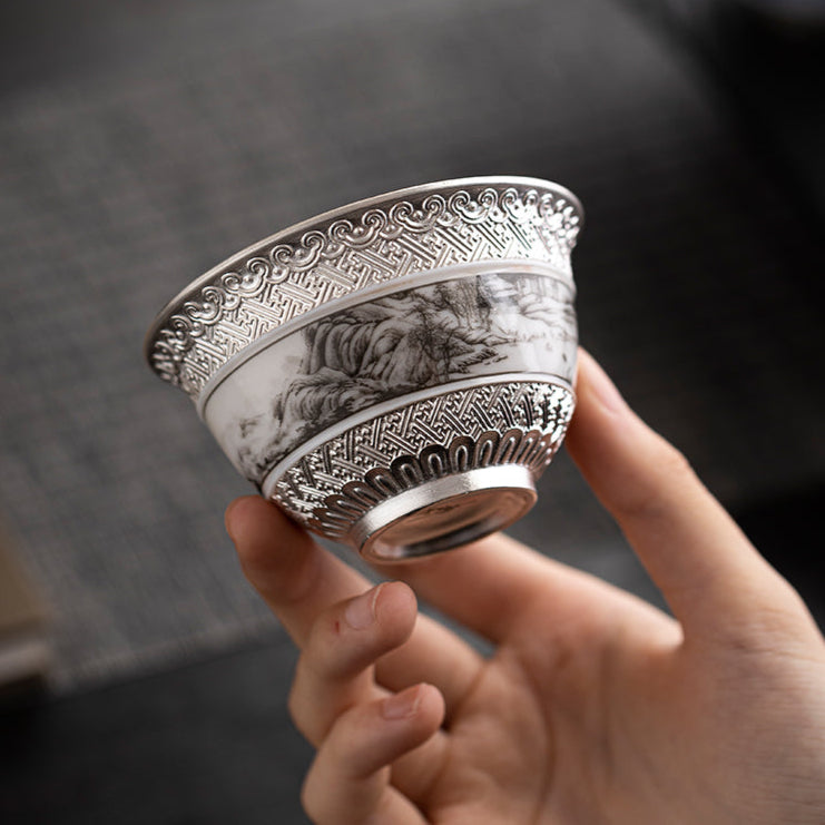 This is a gilted silver ceramic teacup