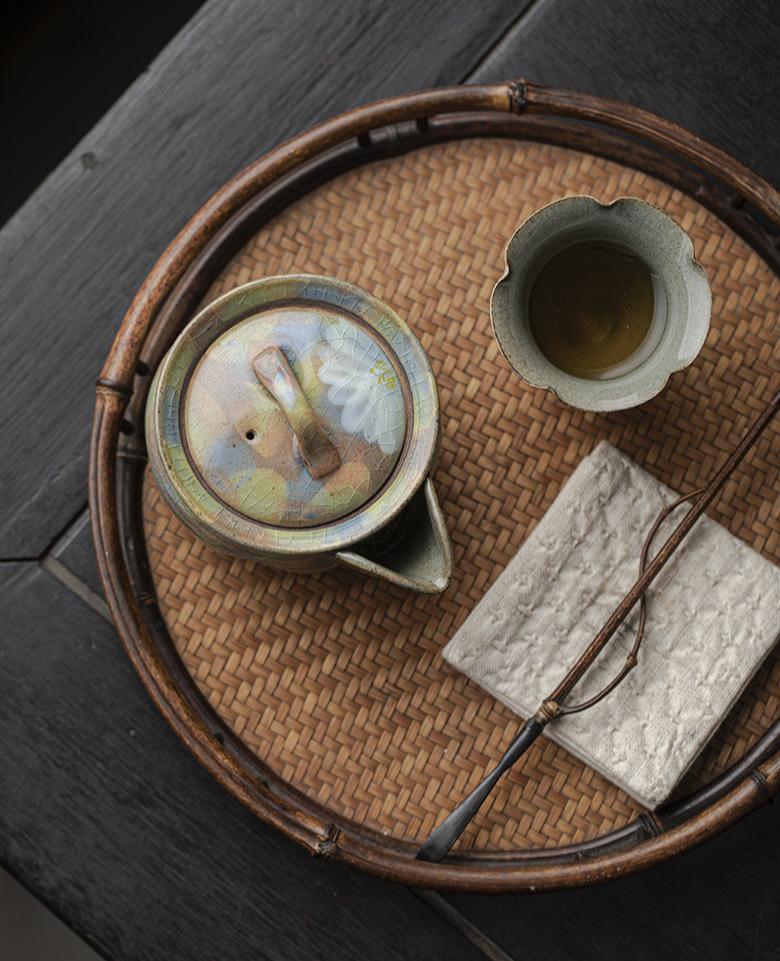 This is a ceramic teapot.this is an iced crackled baoping