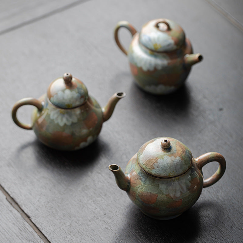 This is a ceramic teapot.this is an iced crackled teapot