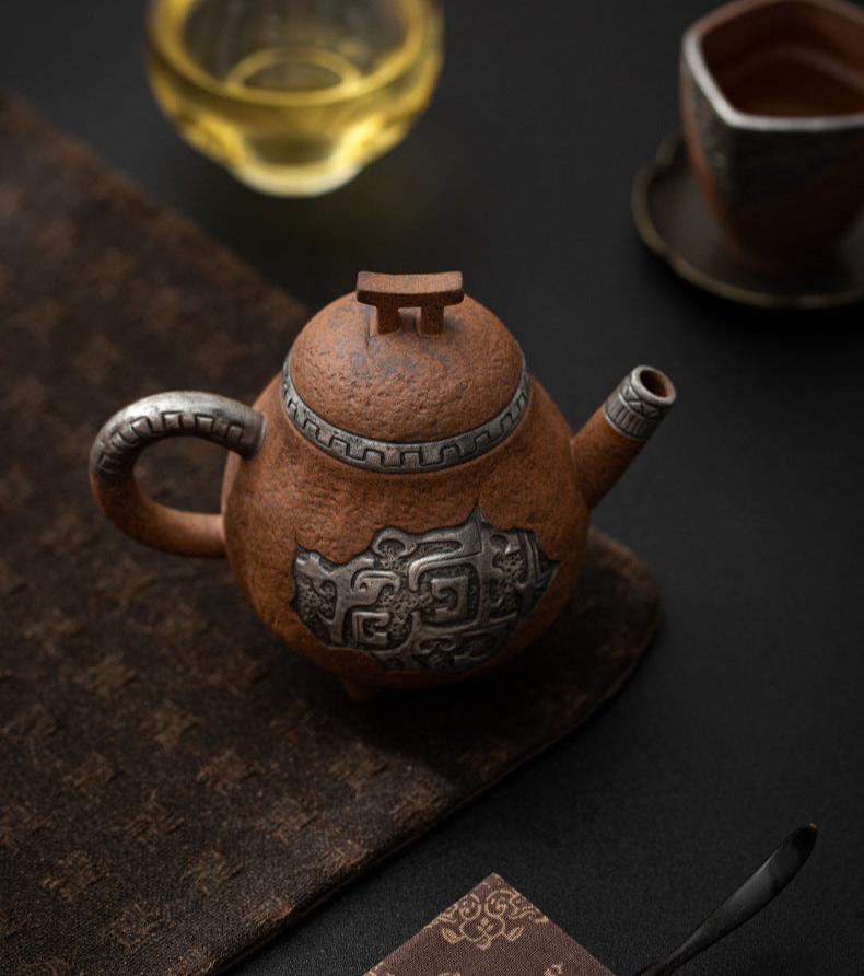 this is a pottery teapot. this is a pear teapot