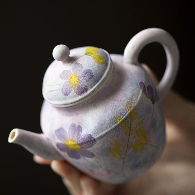 this is a purple ceramic teapot. this is Chinse kohiki teapot