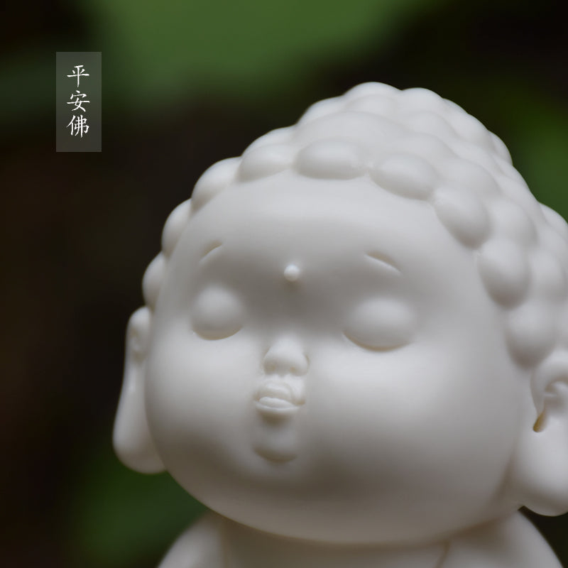 This is a white porcelain buddha teapet incense holder