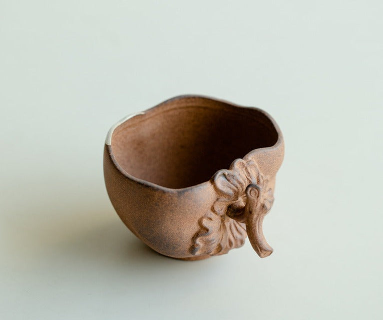 This is a pottery teacup