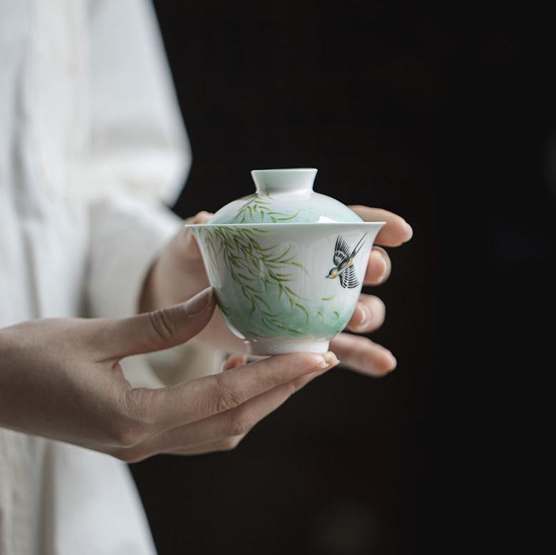 this is a ceramic teapot. this is a green gaiwan