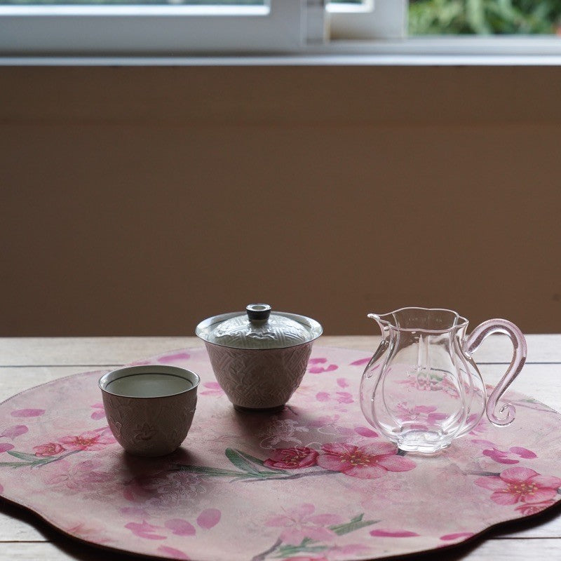 This is a silk brocade tea mat.this is a waterproof table cloth