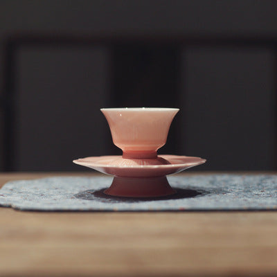 this is a pink ceramic teapot