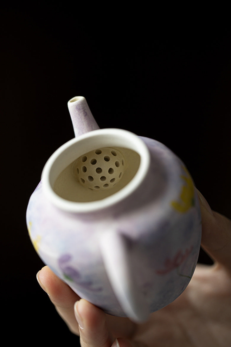 this is a purple ceramic teapot. this is Chinse kohiki teapot