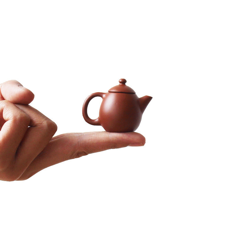 this is a mini zhuni red clay teapot