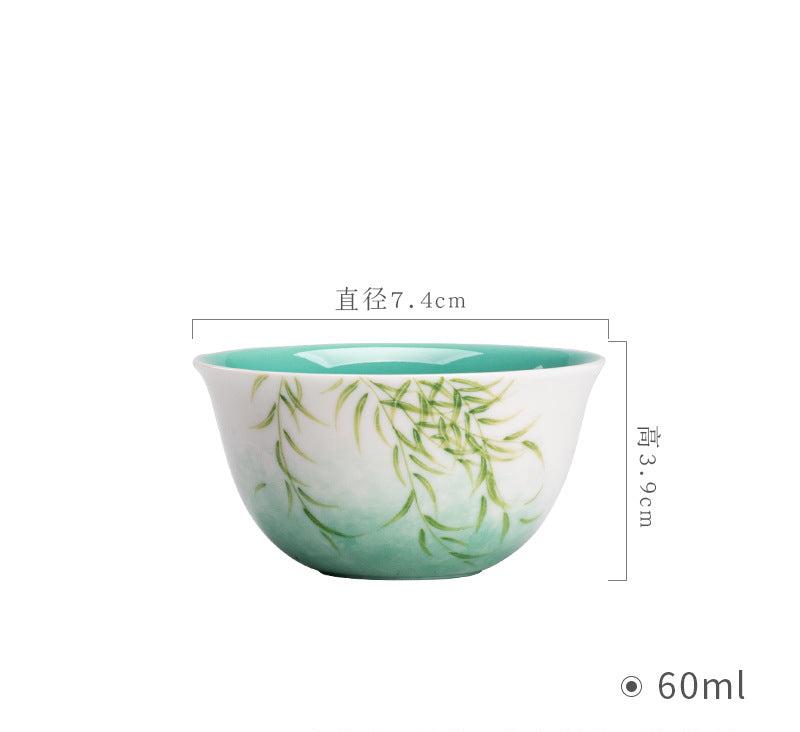 this is a ceramic teapot. this is a green gaiwan