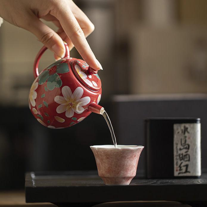 this is a ceramic teapot. this is a red teapot