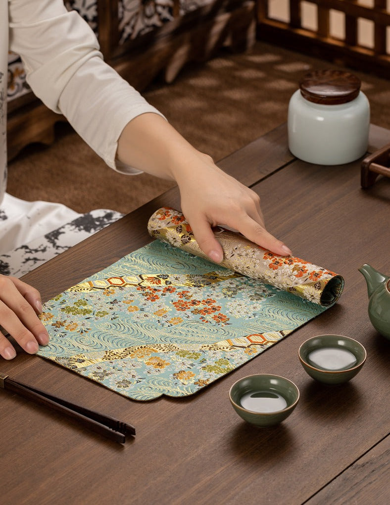 This is a silk brocade tea mat.this is a waterproof table cloth