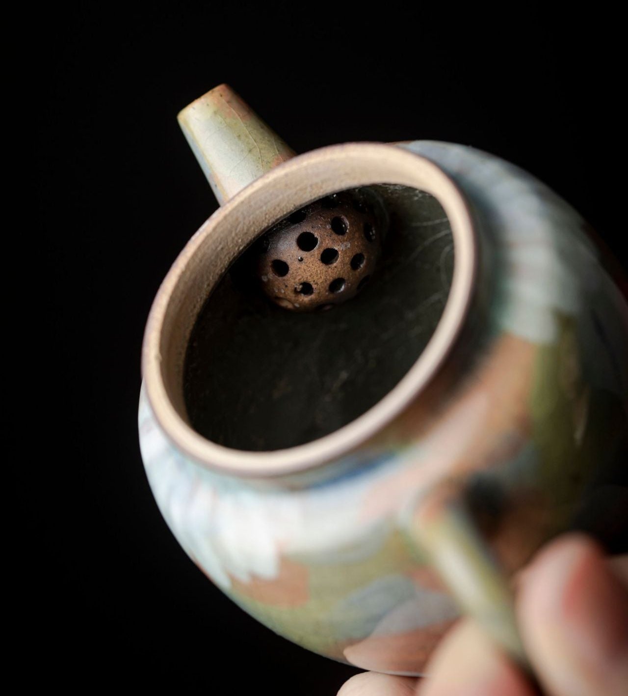 This is a ceramic teapot.this is an iced crackled teapot