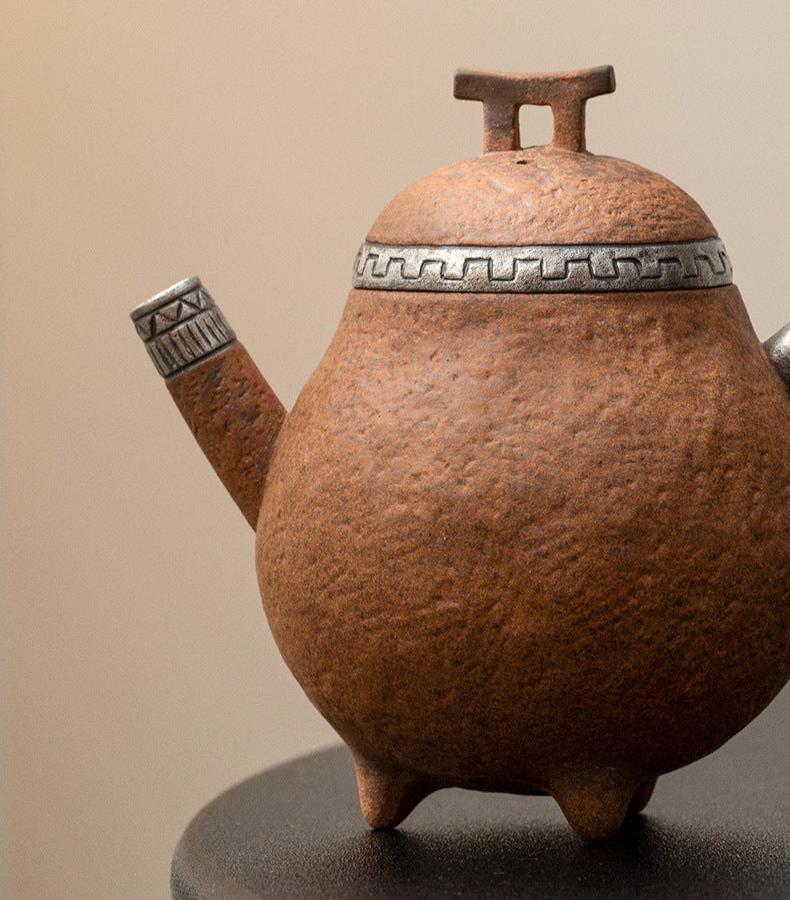 this is a pottery teapot. this is a pear teapot