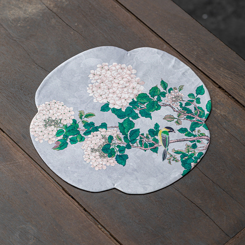 This is a silk brocade tea mat.this is a waterproof table cloth