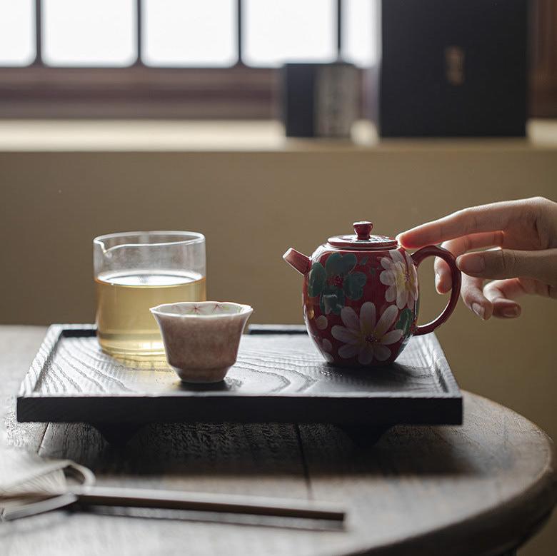 this is a ceramic teapot. this is a red teapot