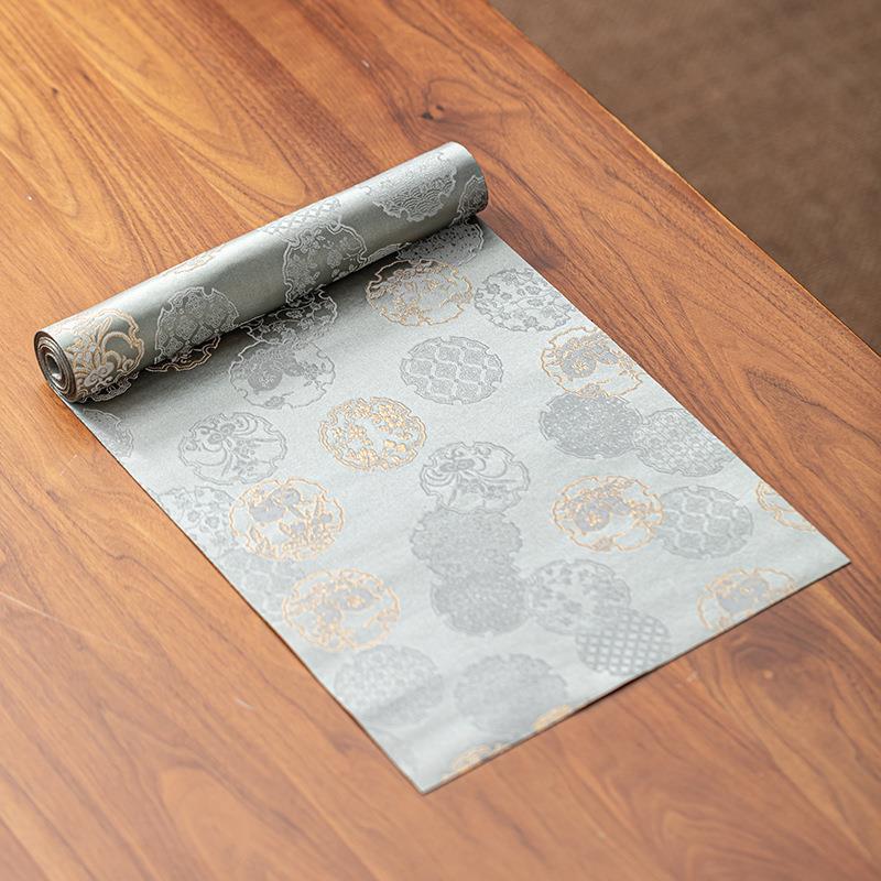 This is a silk brocade tea mat.this is a waterproof table cloth