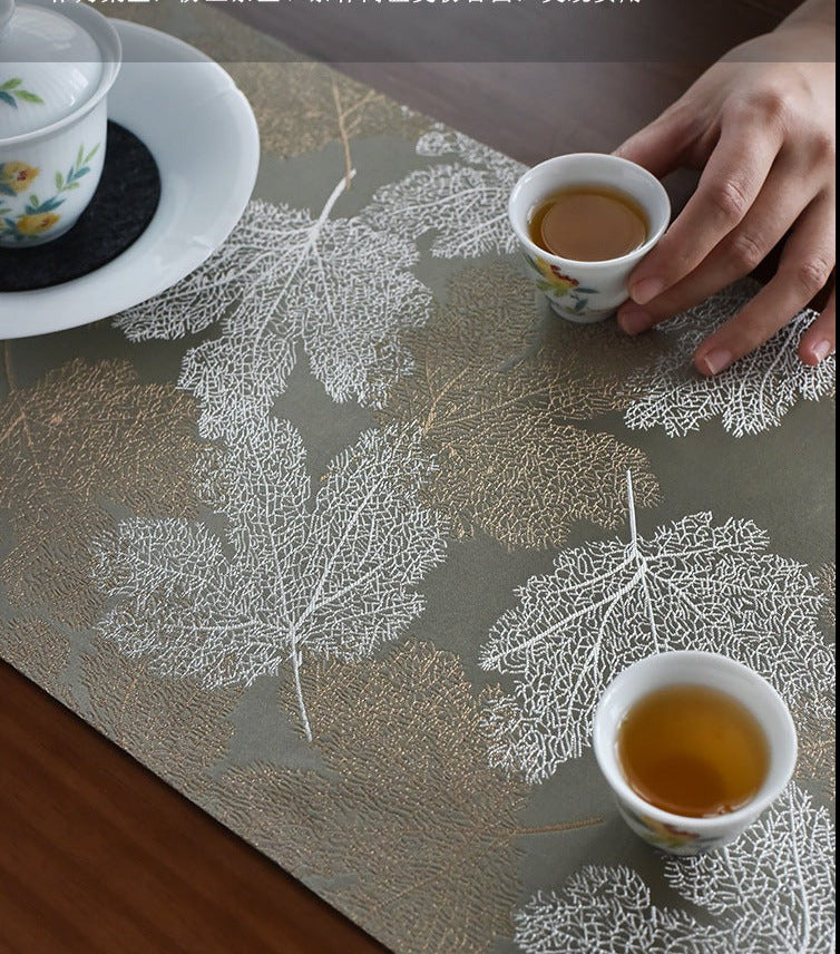 This is a silk brocade tea mat.this is a waterproof table cloth