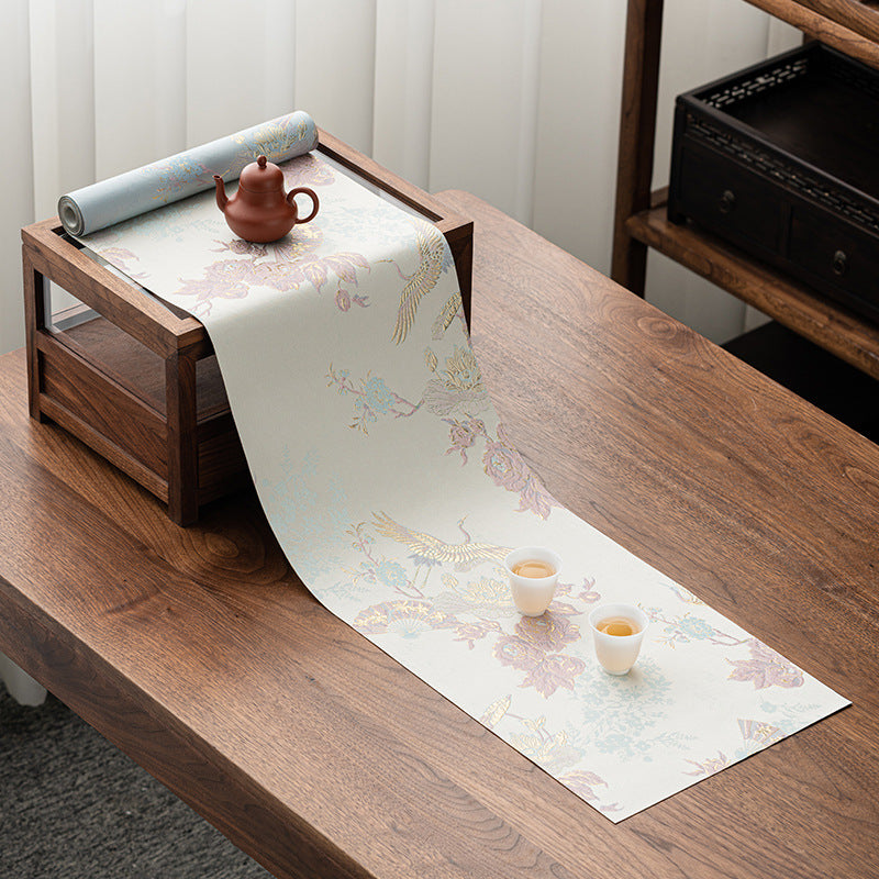 This is a silk brocade tea mat.this is a waterproof table cloth