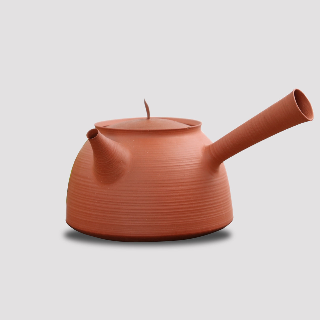 This is a pottery side handle kettle