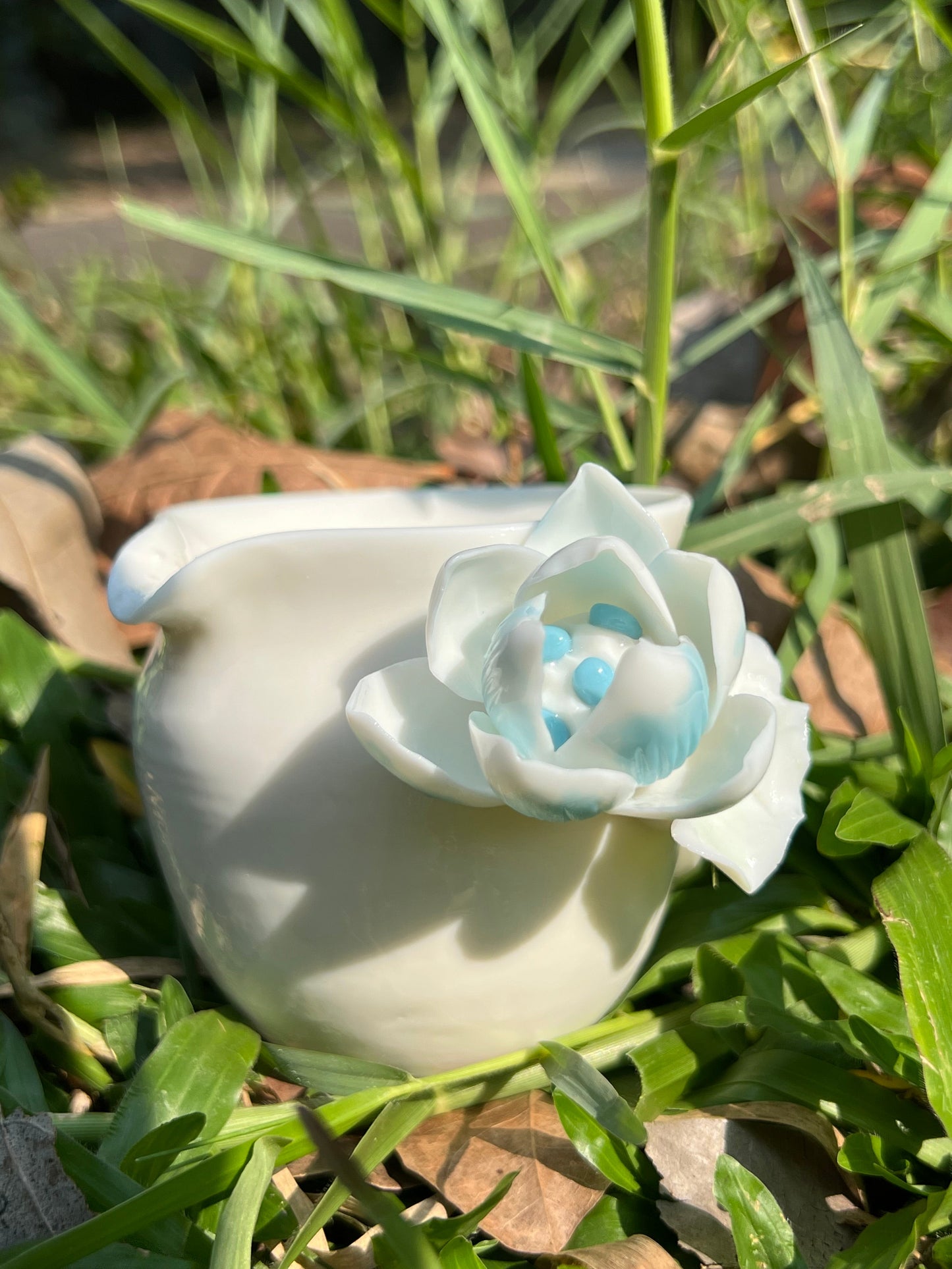 This is a woodfired white pottery flower faircup gongdaobei