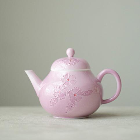 This is a Arita ware teapot. this is a pink ceramic teapot