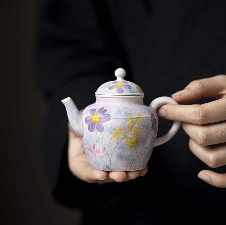 this is a purple ceramic teapot. this is Chinse kohiki teapot