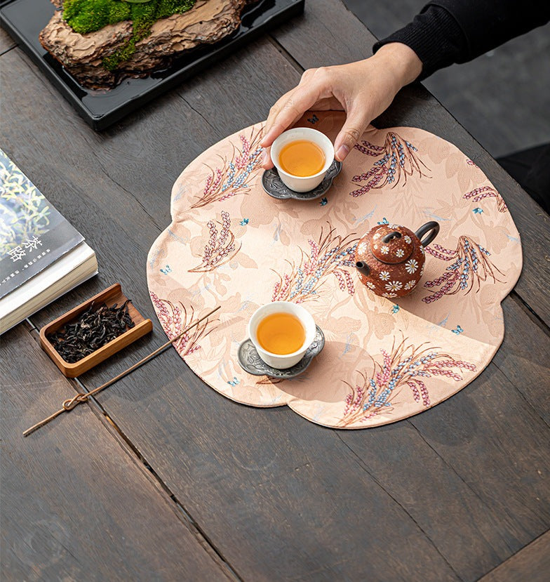 This is a silk brocade tea mat.this is a waterproof table cloth