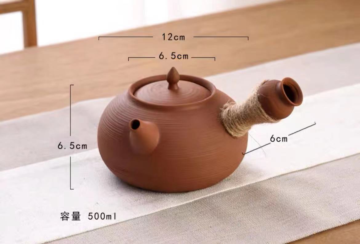 This is a pottery side handle kettle