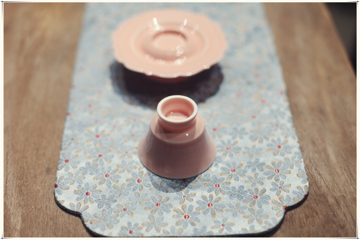 this is a pink ceramic teapot