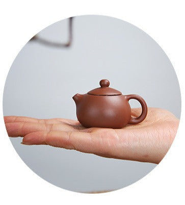 this is a mini zhuni red clay teapot