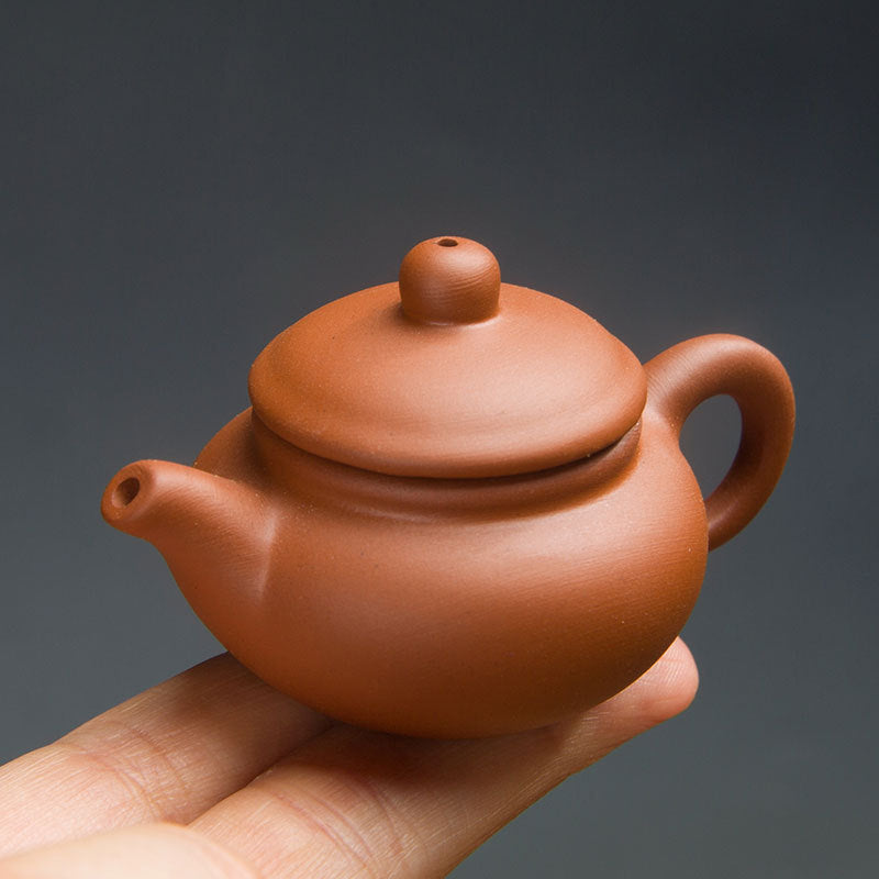 this is a mini zhuni red clay teapot