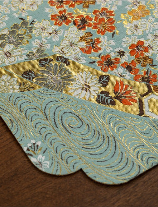 This is a silk brocade tea mat.this is a waterproof table cloth