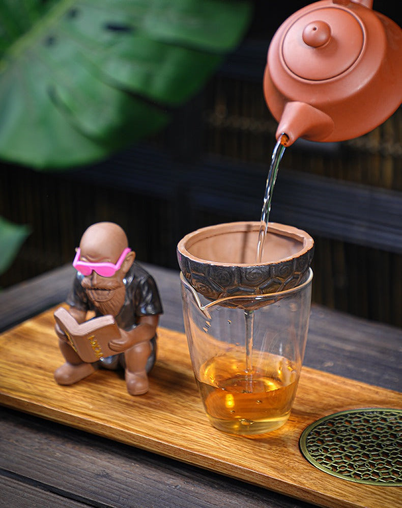 This is a purple clay zisha tea strainer tea filter set.this is a pottery tea separation funnel