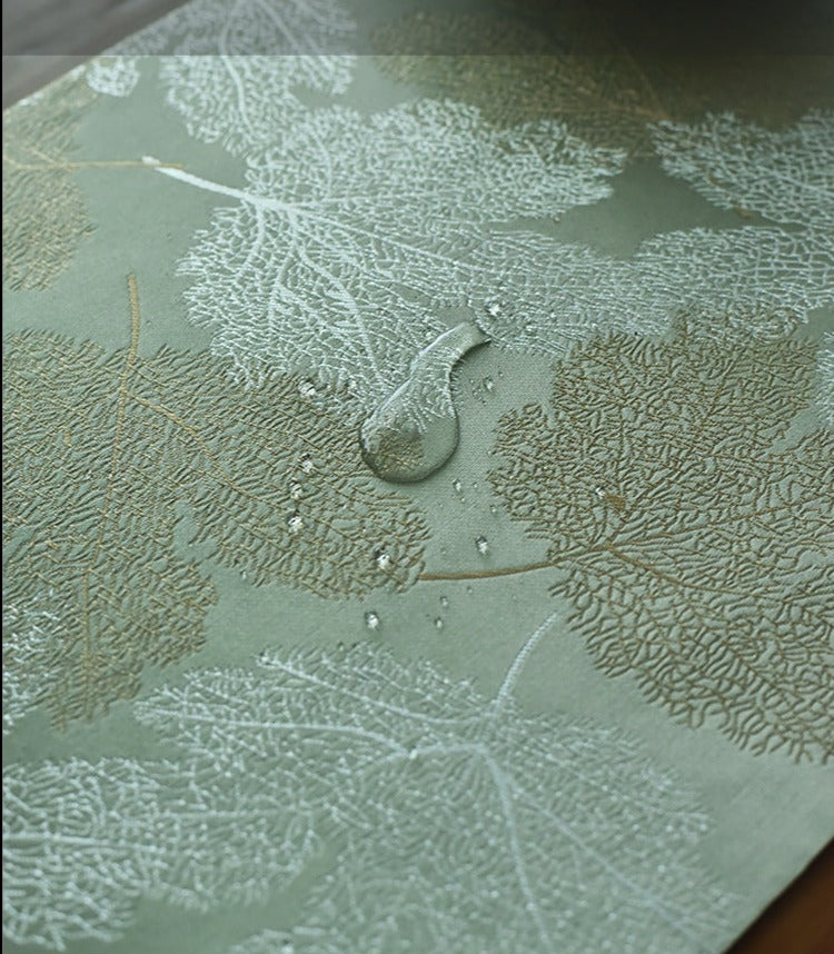 This is a silk brocade tea mat.this is a waterproof table cloth