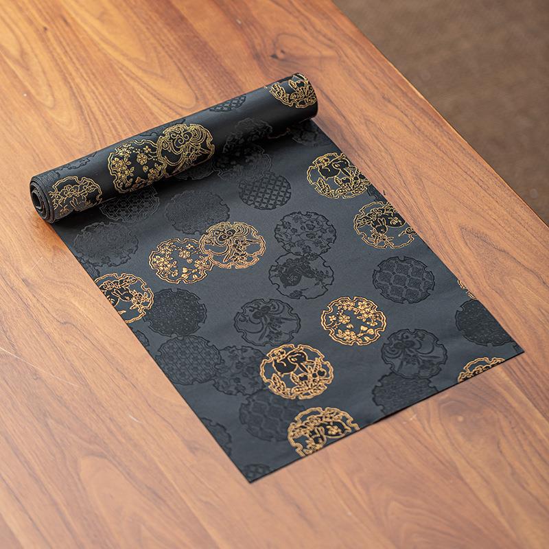 This is a silk brocade tea mat.this is a waterproof table cloth